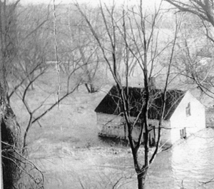 Lockhouse 8 surrounded by flood waters.