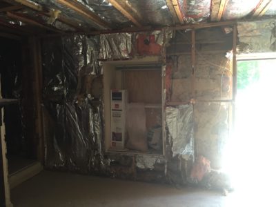 During demo: The 1890s addition with dry wall removed and modern-day insulation intact