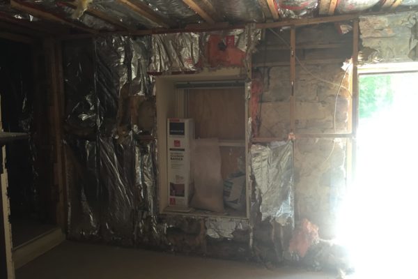 During demo: The 1890s addition with dry wall removed and modern-day insulation intact