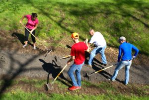 Canal Pride Volunteers spreading stone dust.