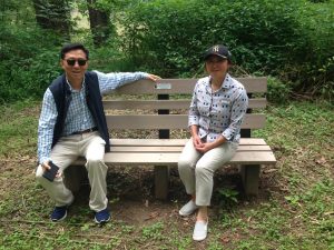 Daofeng and Angela He sit on one of their sponsored benches