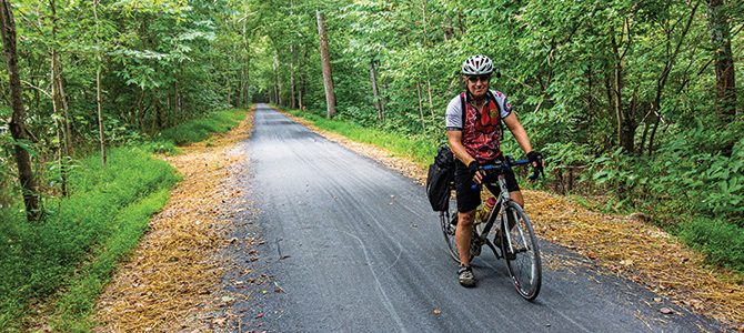 A biker enjoys the resurfaced towpath.